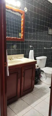 a bathroom with a sink and a toilet at El Paraíso Escondido in San Luis