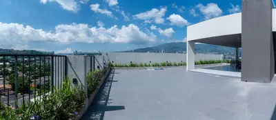 a view of a patio with a fence and a building at Condo 9, San Francisco Tower in San Salvador