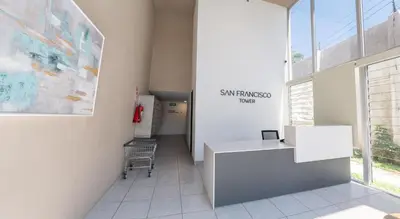 an office with a desk and a chair in a room at Condo 9, San Francisco Tower in San Salvador