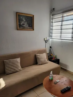 a living room with a couch and a table at Toto's House, near Mall Las Ramblas in Santa Ana