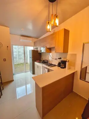 a kitchen with a counter top in a room at Casa Ruta Termal - Ahuachapan in Ahuachapán
