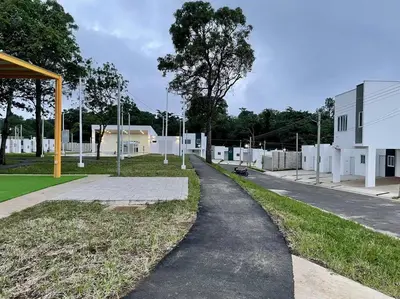 a path leading down a street next to a building at Casa Ruta Termal - Ahuachapan in Ahuachapán