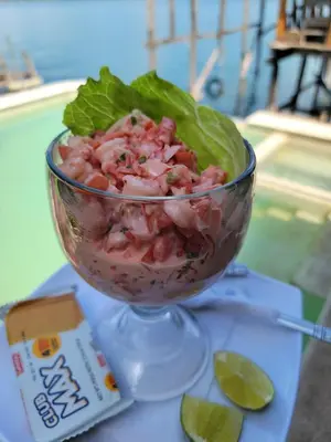 a salad in a glass bowl on a table at Restaurante y Hostal Romayor in Hacienda Santa Rosa