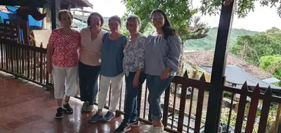 a group of people standing on a balcony at CASA LICHIs in Suchitoto