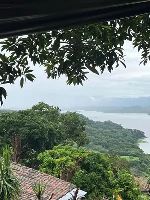 a view of the water and trees from a house at CASA LICHIs in Suchitoto