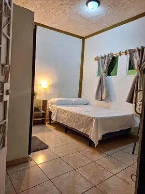 a bedroom with a bed in a room at Casa de Limón 01 in Santa Ana
