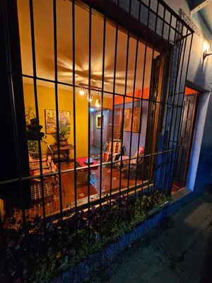 a view of a living room through a iron fence at Santa Fe in Juayúa