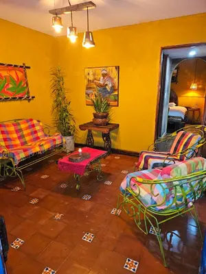 a living room with a couch and a table at Santa Fe in Juayúa