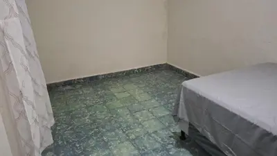 a room with a bed and a tiled floor at Hostal primaveras nest in Santa Ana