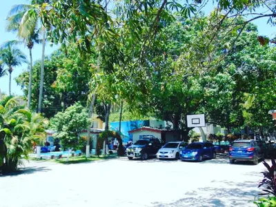 a group of cars parked in a parking lot at Rincon del mar in La Libertad