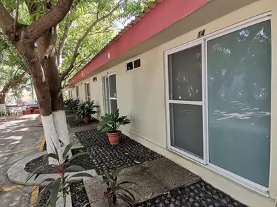 a house with a large sliding glass door at Rincon del atardecer in La Libertad