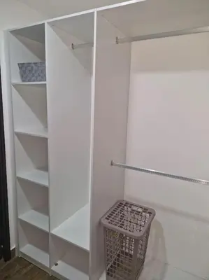 a white cabinet with a basket in a room at Cielito Lindo, vista espectacular en 11 nivel in Antiguo Cuscatlán