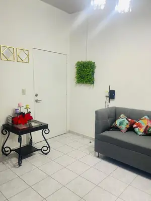 a living room with a couch and a table at Casa tonykey in San Miguel