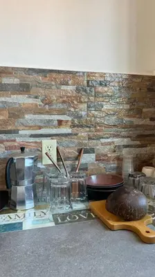a counter with jars and a cake on a table at Apartment Casa Melodia in Chirilagua
