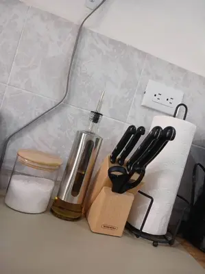 a counter with a bunch of kitchen utensils on it at Casa Villa El Escape en Residencial Villa Panamericana in San Miguel