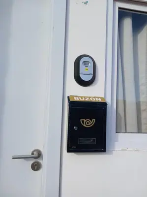 a door with a mail box on the side of it at Casa Villa El Escape en Residencial Villa Panamericana in San Miguel