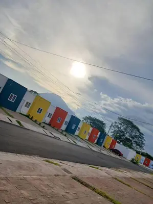 a row of colorful buildings on the side of a street at Casa Villa El Escape en Residencial Villa Panamericana in San Miguel