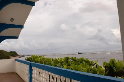 a view of the ocean from the balcony of a house at Casa Coral in Los Cóbanos