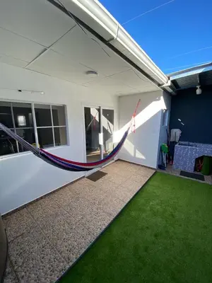 an empty room with a hammock in a house at Ecoterra villas del sol in Comecayo