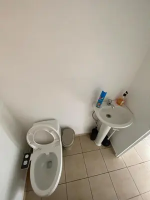 a bathroom with a toilet and a sink at Ecoterra villas del sol in Comecayo