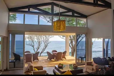 a living room with a view of the ocean at Casa Las Doroteo in El Sunzal