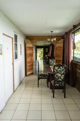 a dining room with a table and chairs at Las Cabañitas in San Salvador