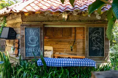 a small building with a sign on the side of it at Las Cabañitas in San Salvador