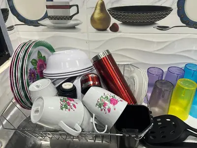 a shelf filled with plates and cups and dishes at Casa en Nueva Metropolis con aire en toda la casa in San Miguel