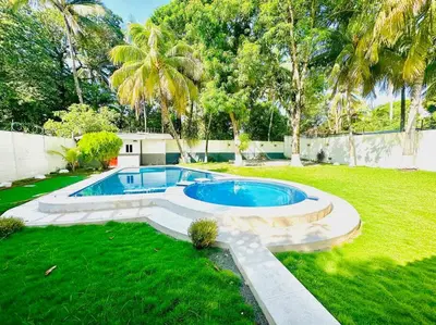 a swimming pool in the middle of a yard at Rancho El Ancla Surf City Wi-Fi AC Pool in La Libertad
