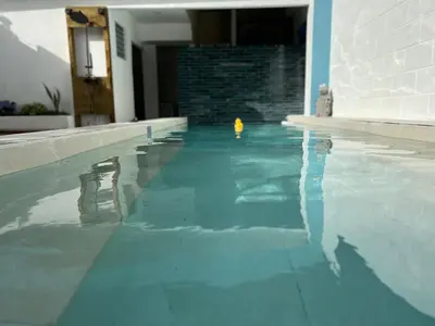 a swimming pool with a yellow toy in the water at Villas de Carolina in San Salvador