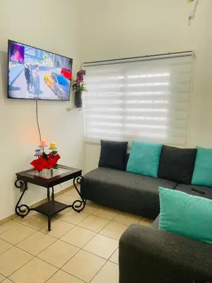 a living room with a couch and a table at casa familiar, HOME sweet HOME san Miguel