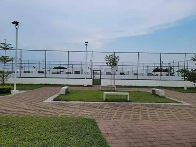 a park with two benches in front of a fence at casa familiar, HOME sweet HOME san Miguel