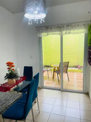 a dining room with a view of a patio at casa familiar, HOME sweet HOME san Miguel