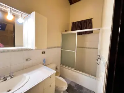 a bathroom with a toilet and a sink and a shower at Apartamento dos habitaciones baños completos WiFi y AC todo el apto, parqueo interno,San Salvador, Colonia escalón in San Salvador