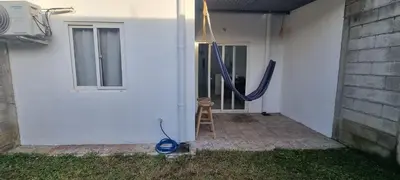 a blue hose is on the side of a house at Residencia en Megápolis, San Miguel in San Miguel