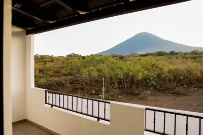 a balcony with a view of a mountain at Beautiful Modern Home in Res San Andres in San Miguel