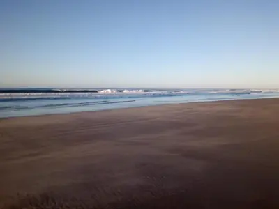 an empty beach with the ocean in the background at Las Brisas Casa frente al mar Costa del Sol in El Zapote