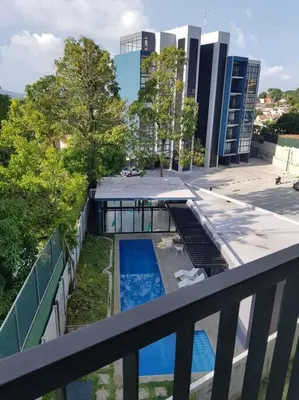 an overhead view of a building with a pool on a balcony at Avitat Fit 3Hab 5P Espectacular Vista al Volcan in San Salvador