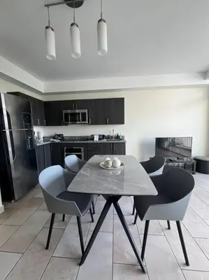 a kitchen with a table and chairs in a room at Avitat Fit 3Hab 5P Espectacular Vista al Volcan in San Salvador