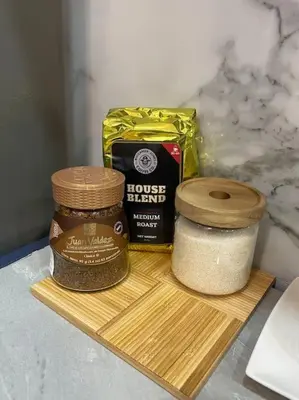 a wooden cutting board with two different types of spices at Golden Glow Getaway in San Miguel