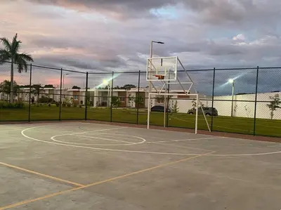a basketball hoop on a court with a fence at Golden Glow Getaway in San Miguel