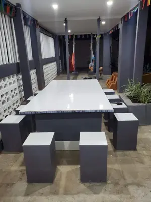 a white table with four stools in a room at Beach house in la libertad in La Libertad