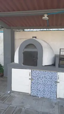 a pizza oven sitting on top of a wall at Beach house in la libertad in La Libertad