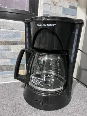 a black blender sitting next to a window at Bambú Family House, AC, WiFi, near Metrocentro Mall in Santa Ana