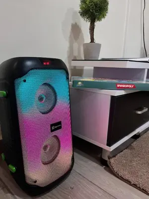 a suitcase is sitting next to a desk at Bambú Family House, AC, WiFi, near Metrocentro Mall in Santa Ana