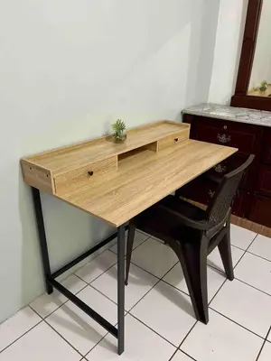 a wooden desk with a chair in a room at Casa Familiar in San Miguel