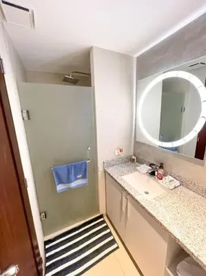 a small bathroom with a sink and a mirror at Upper Scale and Cozy Apart in the Heart of Escalon in San Salvador