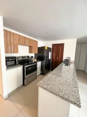 a kitchen with a stove and a counter top at Upper Scale and Cozy Apart in the Heart of Escalon in San Salvador