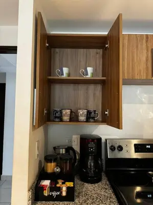 a kitchen with a counter top with a coffee maker at Upper Scale and Cozy Apart in the Heart of Escalon in San Salvador