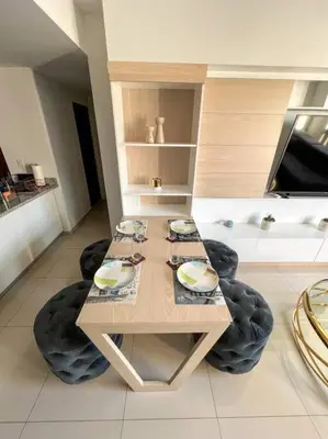 a table and two chairs in a room at Upper Scale and Cozy Apart in the Heart of Escalon in San Salvador